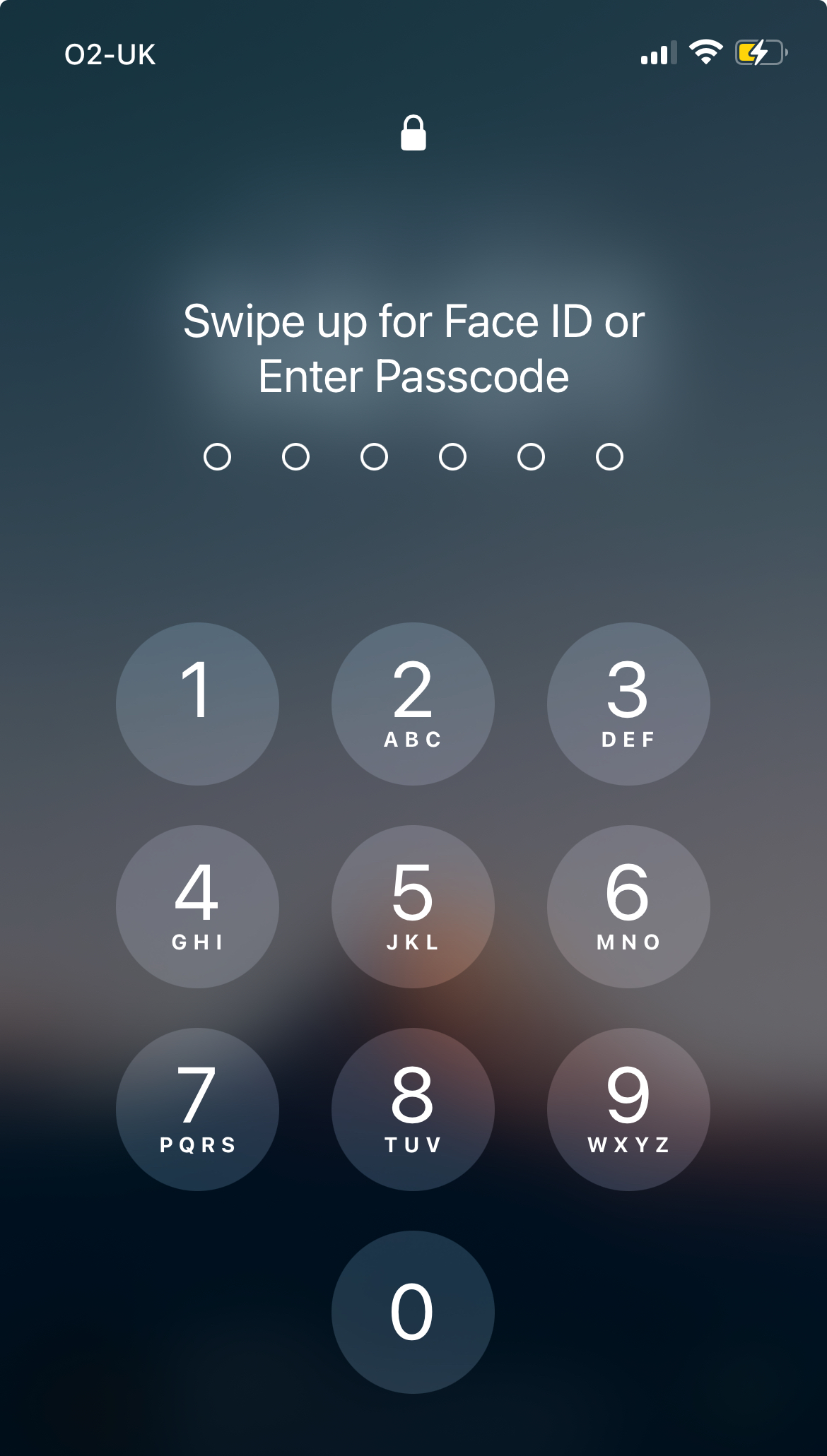 The iOS lockscreen where either FaceID or a Passcode is provided.