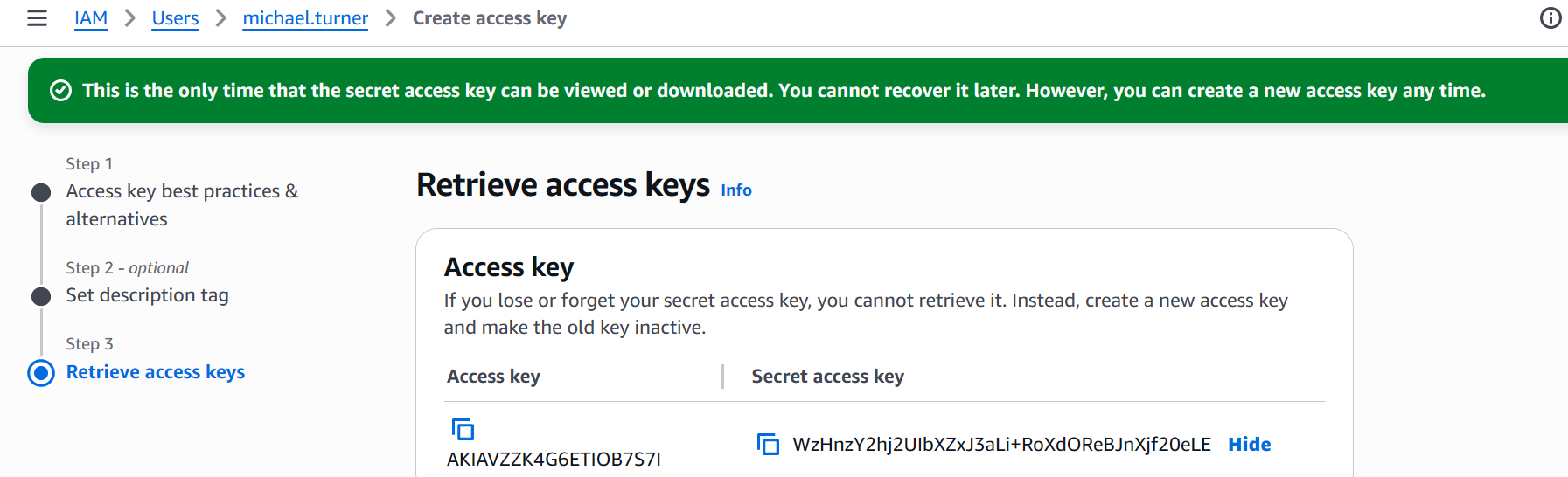 AWS IAM console screenshot showing the Create access key workflow for user michael.turner. The page displays the generated Access key ID and Secret access key.